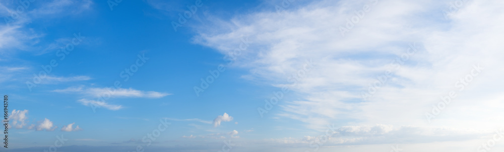 Panoramic blue sky background with white clouds on a sunny day Panoramic blue sky background with white clouds on a sunny day