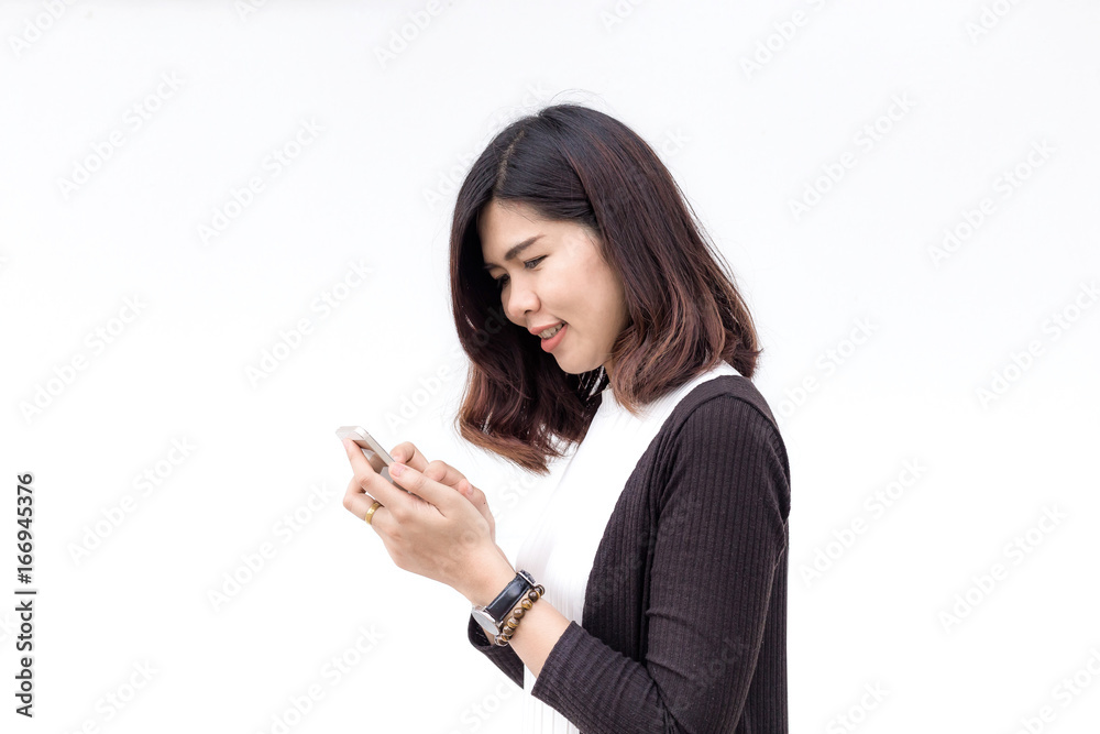 Portrait of a smiling casual woman holding smartphone over white background Portrait of a smiling casual woman holding smartphone over white background