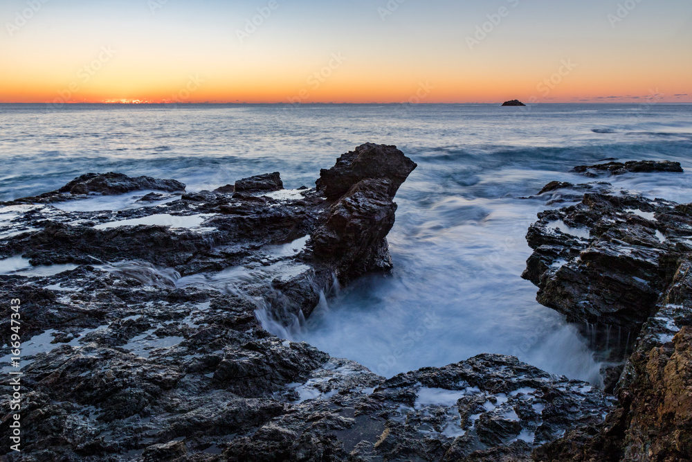 Sunrise over the rocks at Flagstaff hill - moving water