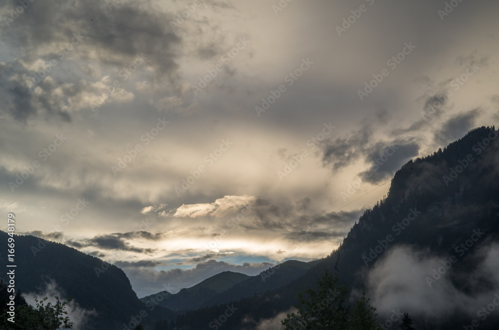 Majestic scenery of rocky mountains at golden sunset in Dolomites National Park