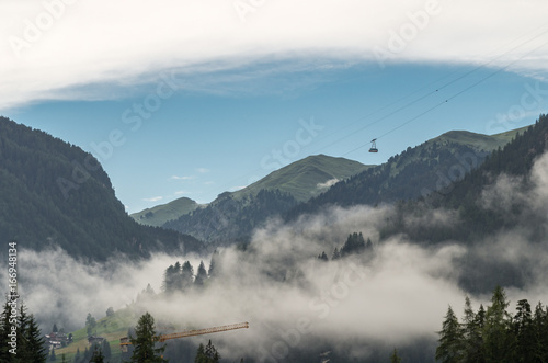 Majestic scenery of rocky mountains at golden sunset in Dolomites National Park photo