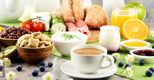 Breakfast served with coffee, cheese, cereals and scrambled eggs