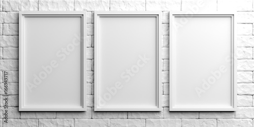 White frames on white brick background. 3d illustration photo