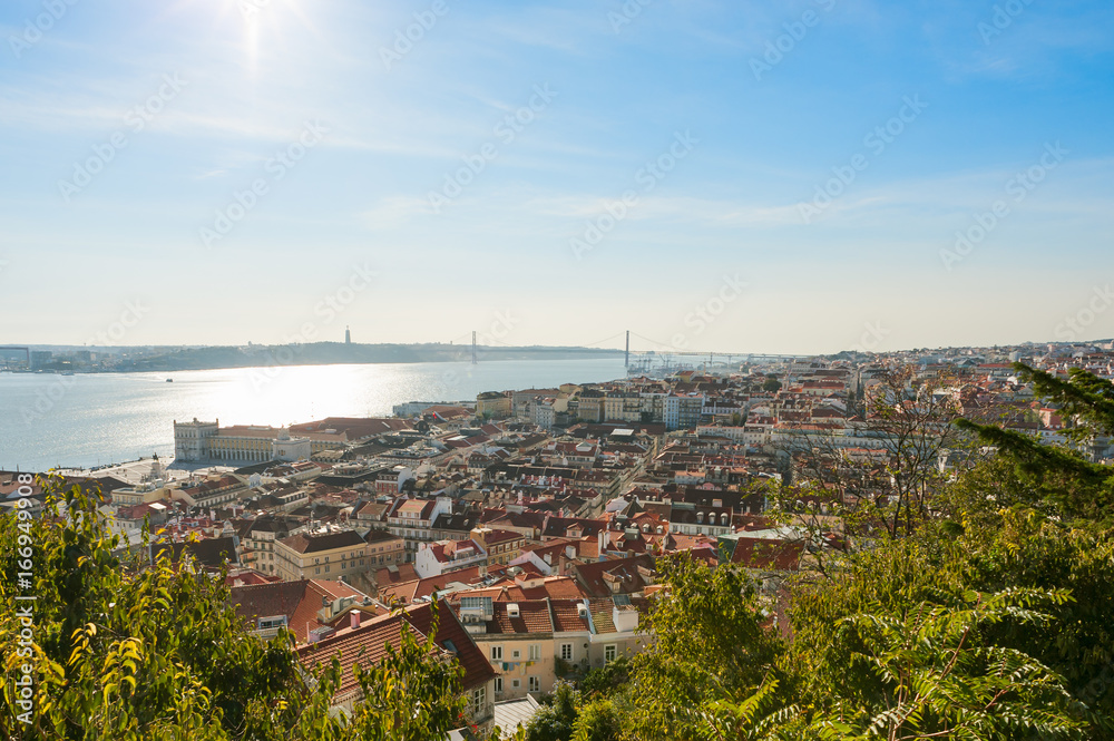 Lisbon roofs aerial view with bridge in the background, Portugal