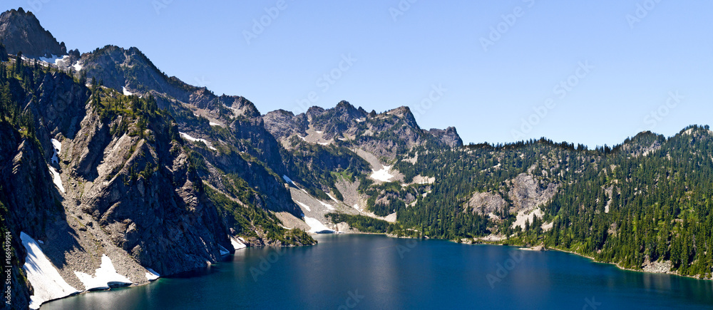 Aerial photo of flying sunny mountain lake view of Snow Lake near Alpental in the Washington State Cascade Mountains
