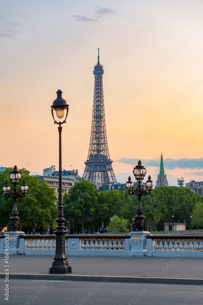 Paris Eiffel tower and lamppost with orange sky, France