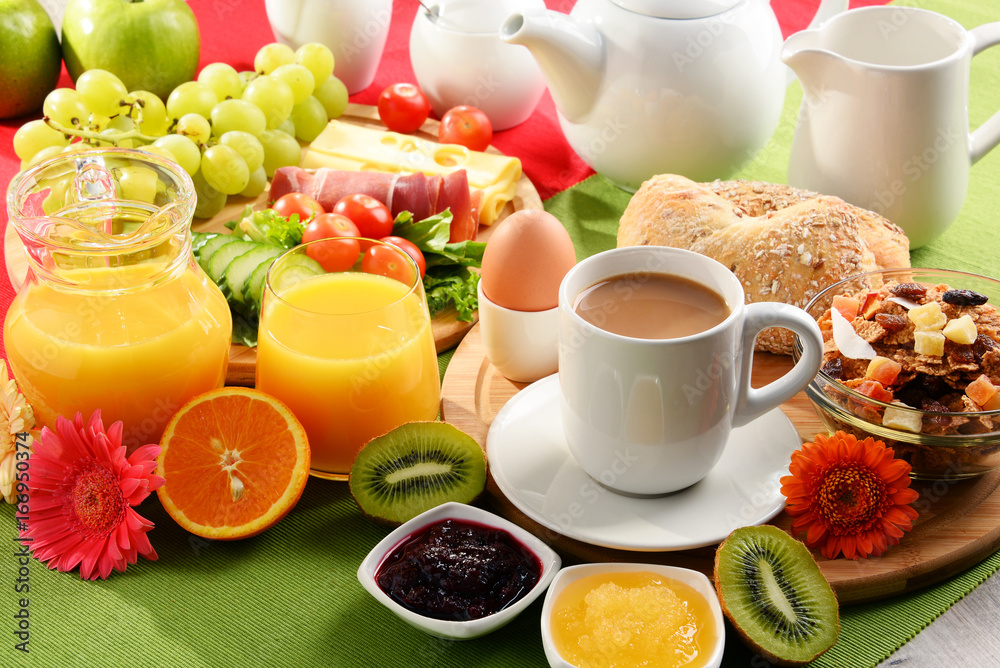 Breakfast served with coffee, orange juice, egg and fruits Breakfast served with coffee, orange juice, egg and fruits