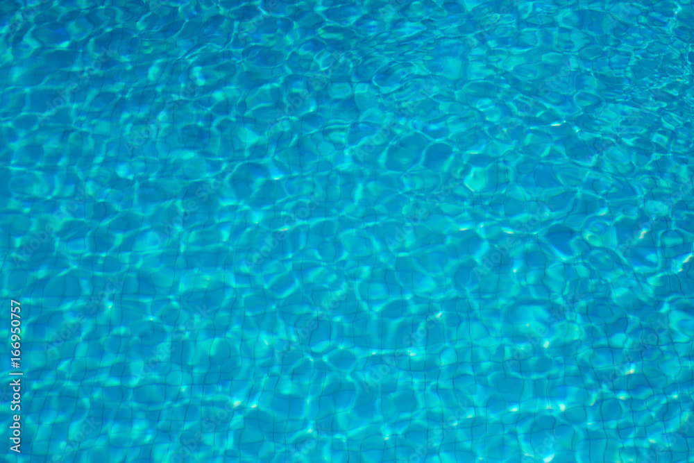 Ripples on a clear blue swimming pool