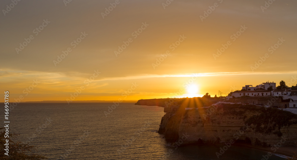 Beautiful golden sunset over Carvoeiro in Portugal
