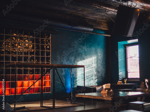 Loft style cafe interior with sun light
