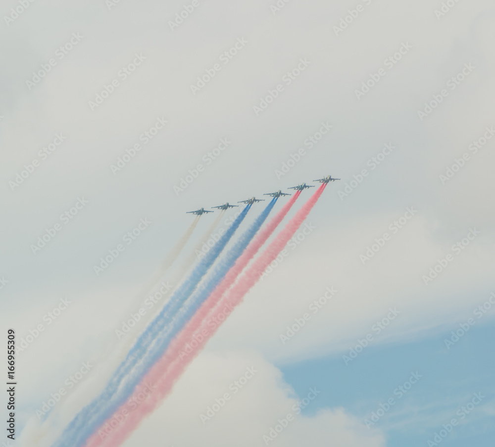Russia, Saint-Petersburg, July 30, 2017, in celebration of the Navy, the flight of aircraft made out of the smoke a Russian flag over the city. Russia, Saint-Petersburg, July 30, 2017, in celebration of the Navy, the flight of aircraft made out of the smoke a Russian flag over the city.
