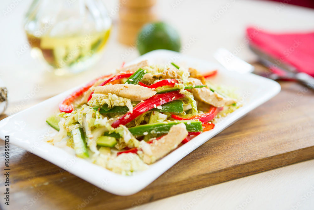 Homemade Vegetable salad on a plate on wooden cutting board Homemade Vegetable salad on a plate on wooden cutting board