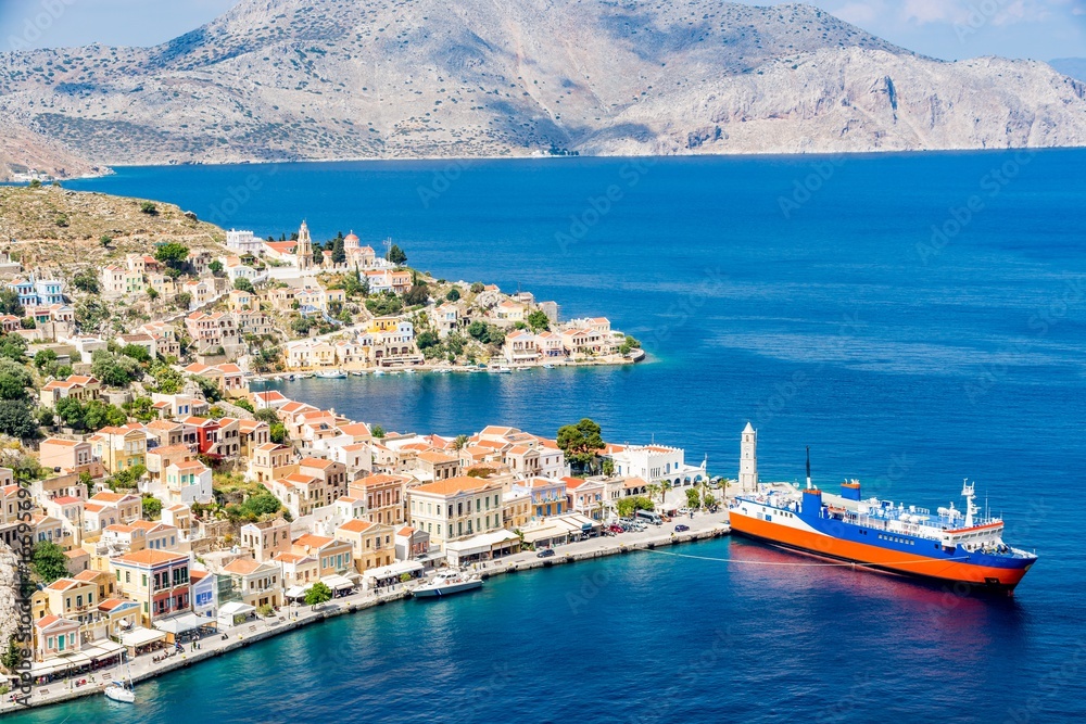 Cityscape of a picturesque Symi town, capital of Symi island, Greece