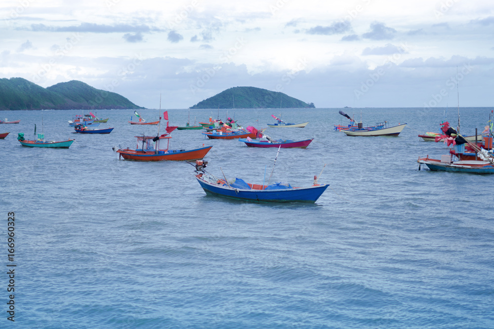 Fishing boats Float on the sea on a beautiful blue sky