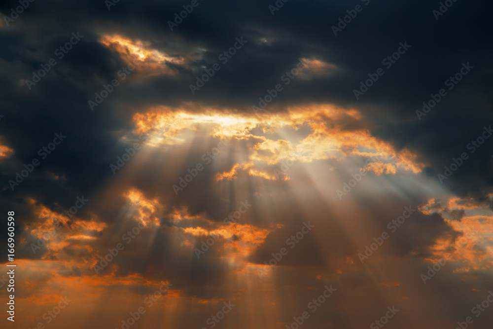 Fototapeta dramatic sunset with clouds and sun rays