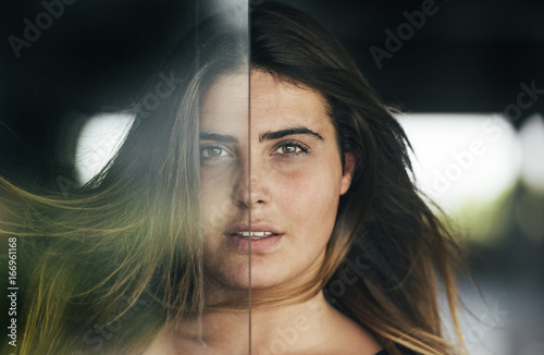 Portrait of woman behind glass