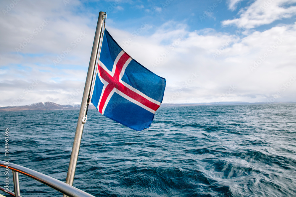Fototapeta premium Icelandic flag against the sea