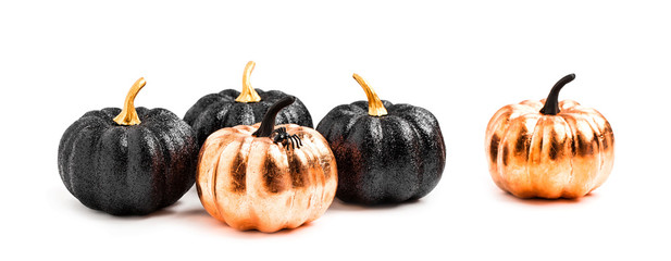 Stylish Halloween decorations. Shiny Decorative Pumpkins. Minimal creative stillife. Isolated