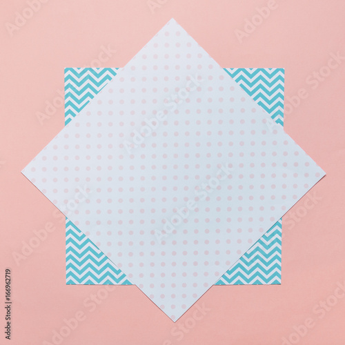 abstract minimal texture background with abstract colorful papers, geometric pattern and polka dots print. flat lay, top view. photo