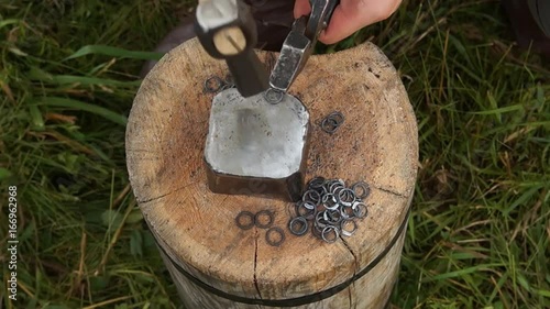 man making chain armor, blacksmith