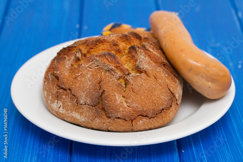 corn bread with smoked sausage farinheira on white plate