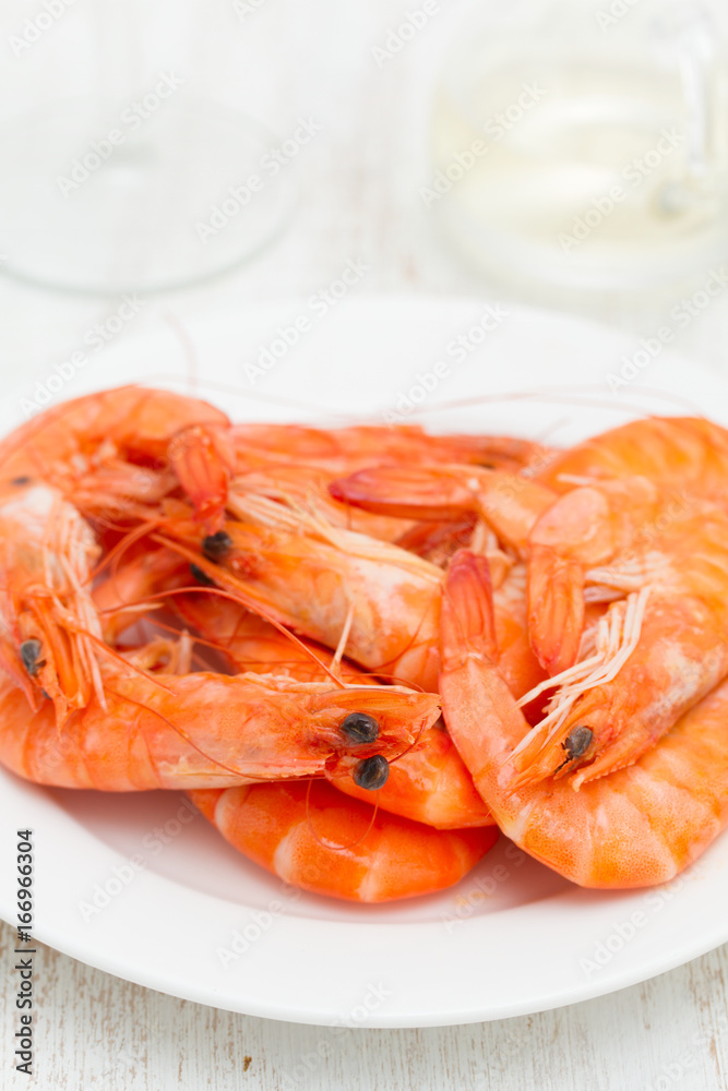 boiled shrimps on white dish on wooden background boiled shrimps on white dish on wooden background