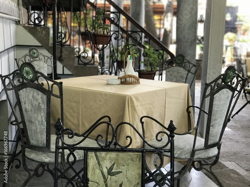 Outdoor table with metal chairs in Old Town Plovdiv, Bulgaria