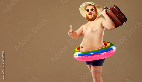 Funny bearded man prepared for beach vacation photo