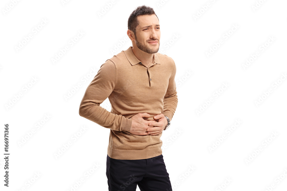 Fototapeta premium Young man experiencing stomach pain