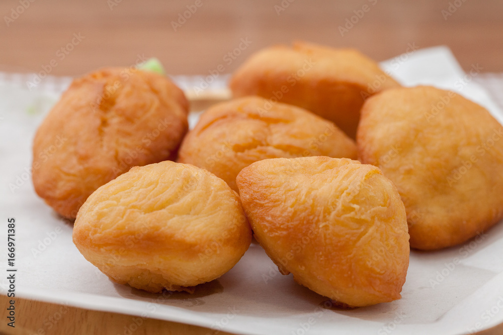 Chinese fried Dough bun on wooden plate