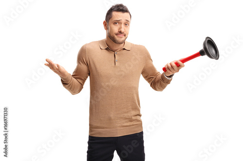 Tableau sur toile Confused guy holding a plunger
