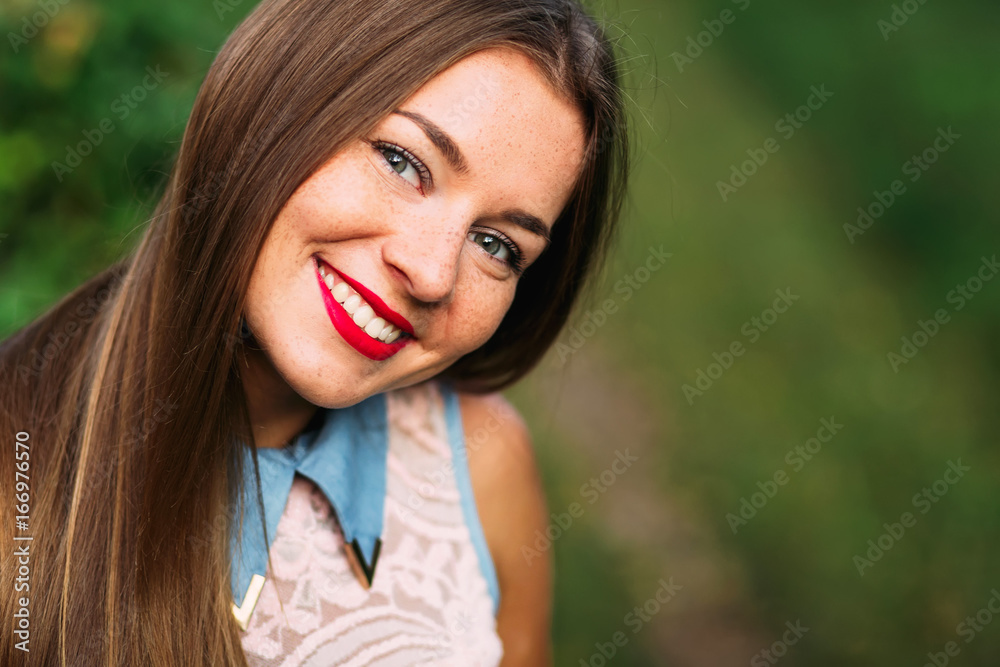Close up of charming teenage girl with amazing smile and long cu Close up of charming teenage girl with amazing smile and long cu