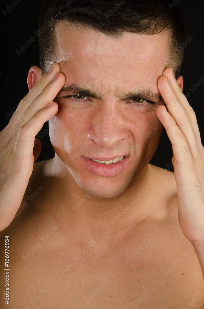 Migraine. Attractive guy. Black background. Migraine. Attractive guy. Black background.