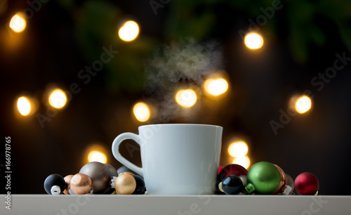 White cup of coffee at Christmas decoration