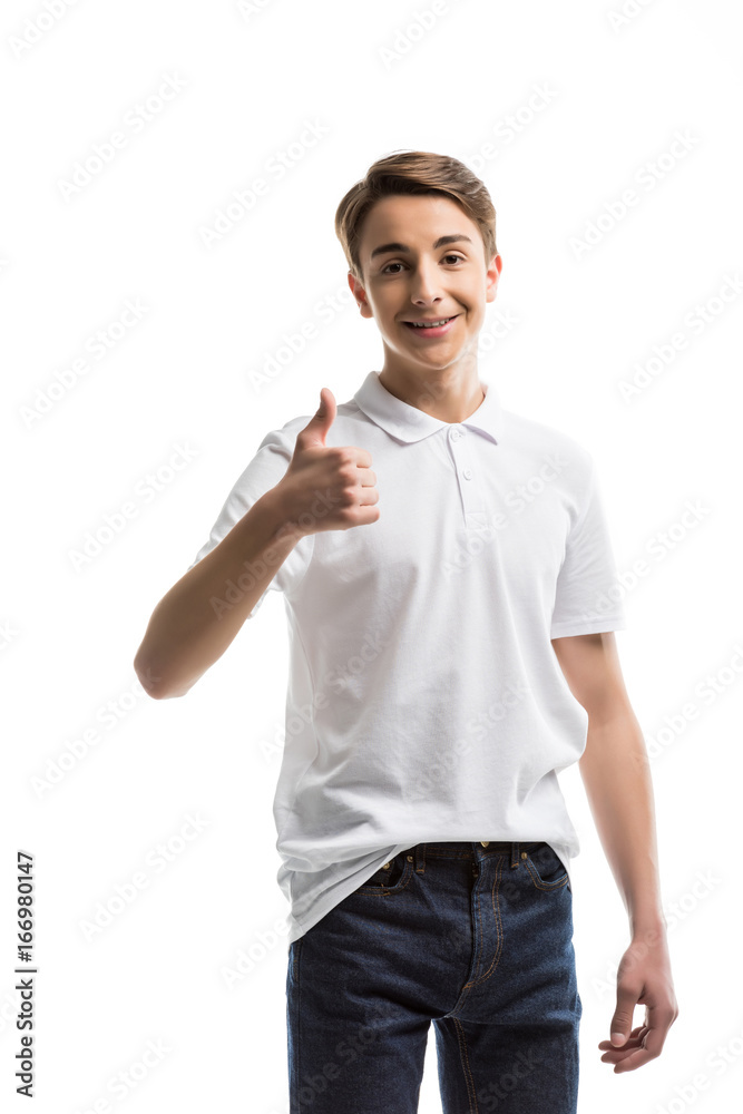 portrait of smiling caucasian teenager showing thumb up while looking at camera isolated on white portrait of smiling caucasian teenager showing thumb up while looking at camera isolated on white