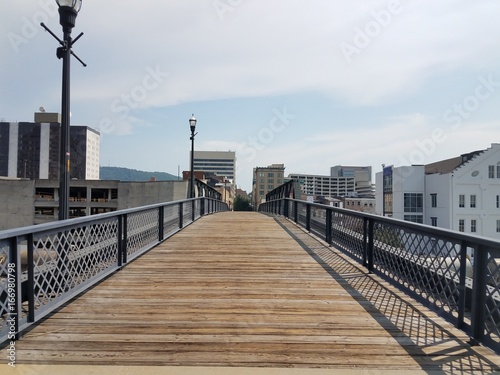 boardwalk leading into city © Justin