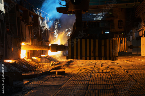 Obraz na plátně Loading of ore in the open-hearth furnace at a metallurgical plant