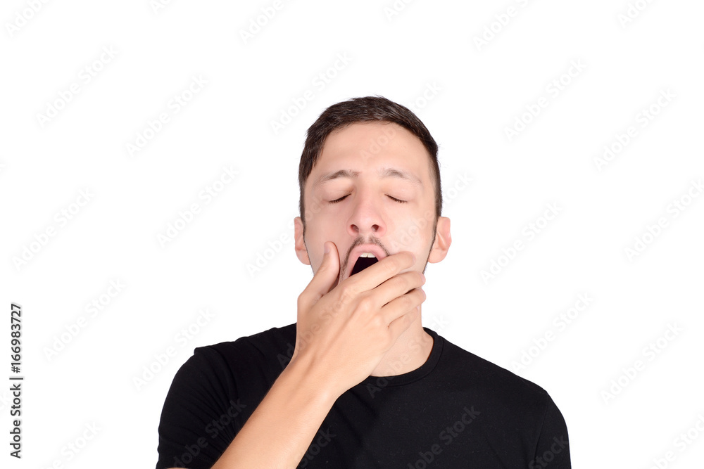 Young man yawning.