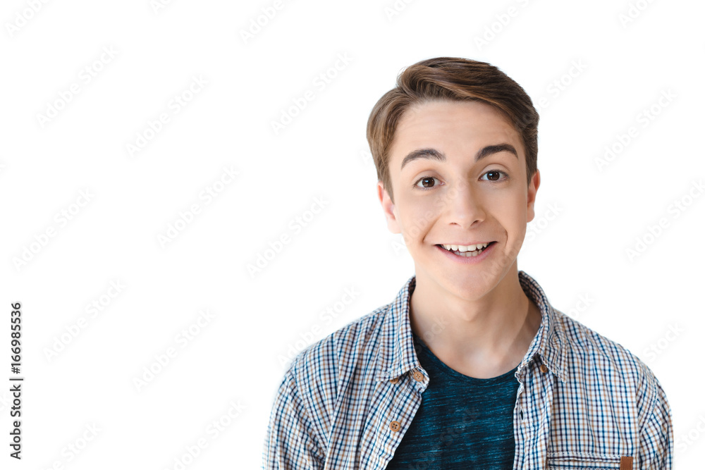 head and shoulders shot of excited caucasian teen boy looking at camera isolated on white head and shoulders shot of excited caucasian teen boy looking at camera isolated on white
