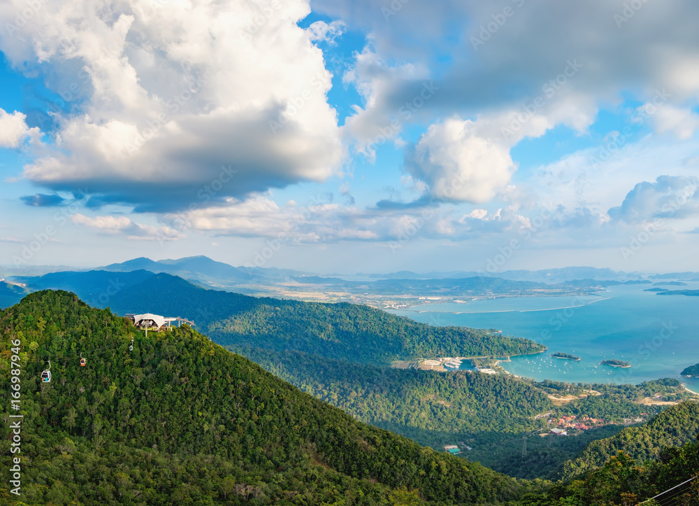 Panoramic view of blue sky, sea and mountain seen from Cable Car viewpoint, Langkawi, Malaysia. Picturesque landscape with beaches, small Islands and tourist ships at waters of Strait of Malacca