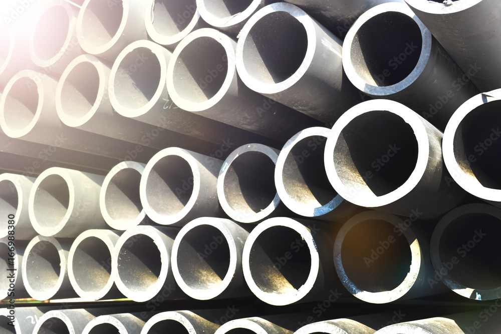 Plastic pipes in stock of finished products stacked in packs Plastic pipes in stock of finished products stacked in packs
