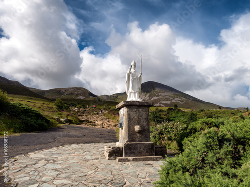 Pathway start with statue to Croagh Patrick in Westport Ireland photo