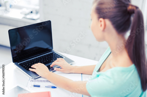 businesswoman with laptop computer in office