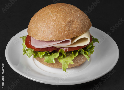 Ham and cheese sandwich with tomato and lettuce