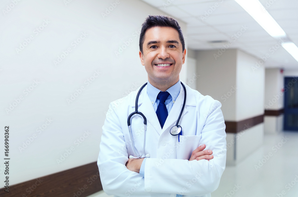 smiling doctor in white coat at hospital smiling doctor in white coat at hospital