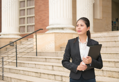 lawyer woman standing in front of the court