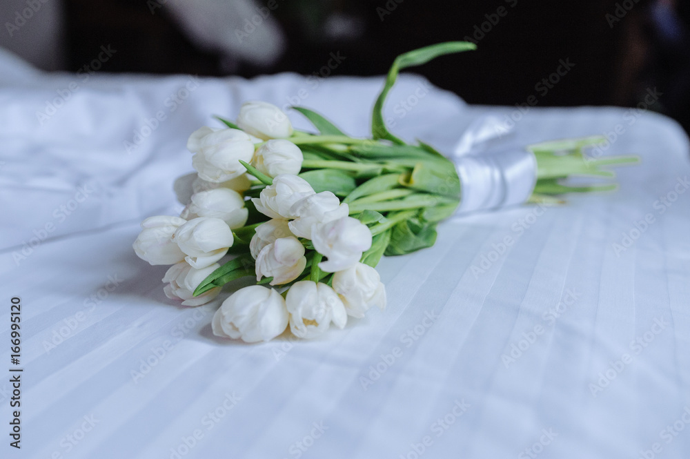 Bouquet of tulips on white bed Bouquet of tulips on white bed