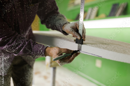 Shaping a surfboard photo