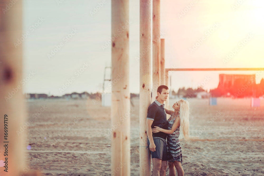 Young couple in love walking on the beach