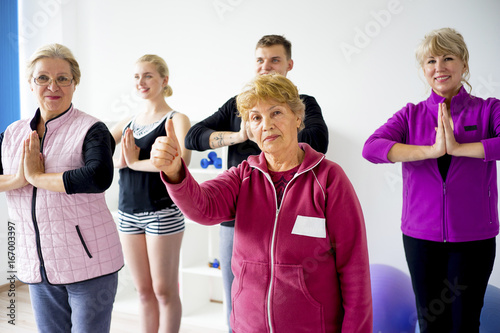 Group of elderly people doing exercises